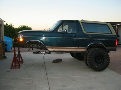 1994 Ford Bronco - 1994 Ford Bronco undergoing frame preparation, front end disassembled.