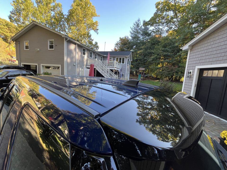 Overhead view of the black roof and sunroof of a Ford Explorer SUV