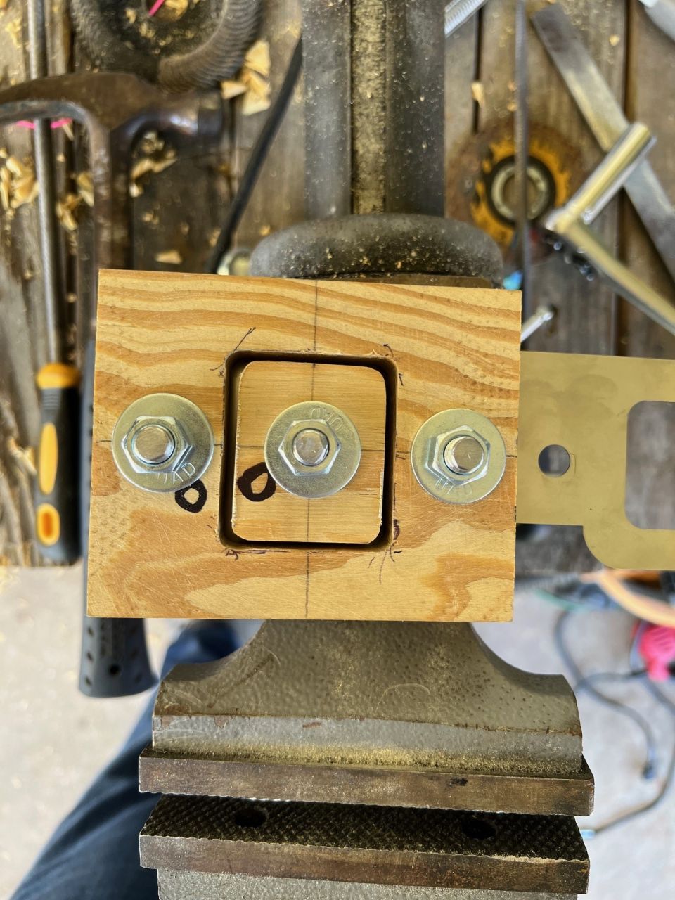 My little jig to emboss. I tried to use the vice to press it, but got nothing. A hammer worked fine.