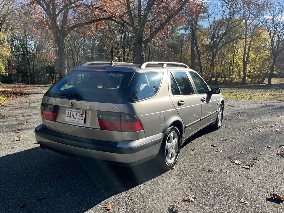 Tan wagon rear view, Massachusetts license plate 4AHJ 35
