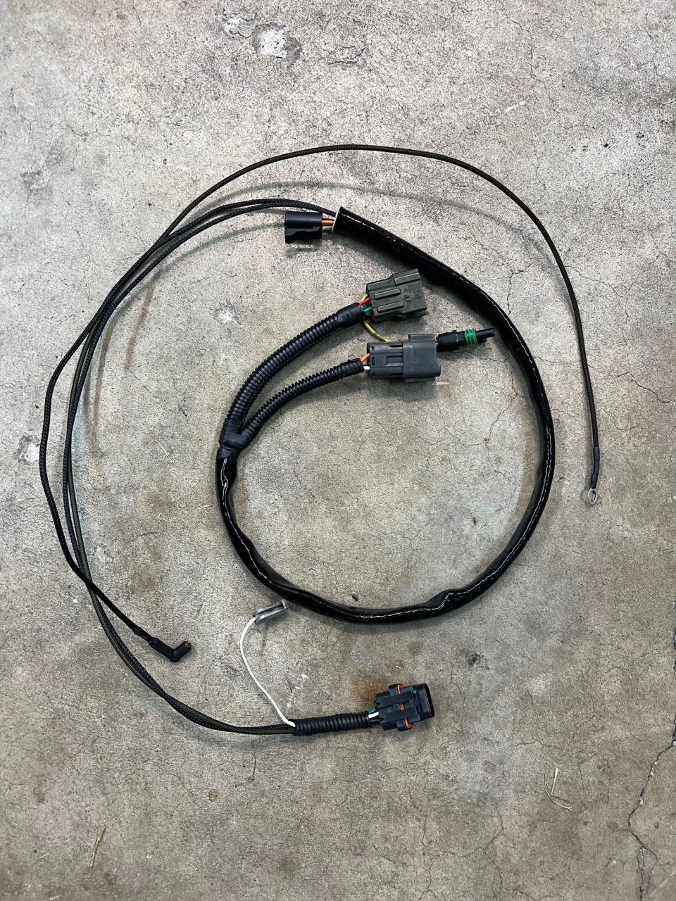Alternator, coolant sensor, and oil sensor wire harness.