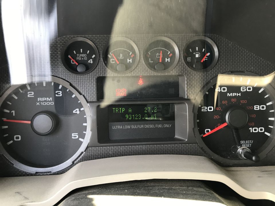 Dashboard gauges showing RPM, speed, turbo PSI, fuel, temp, and trip odometer at 93,123 miles