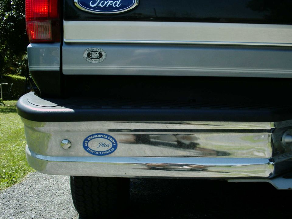 Rear bumper of a Ford Bronco with two stickers.