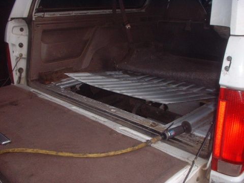 1995 Ford Bronco - Cut the hole. Front to back i cut between the braces on the frame. Side to side i cut the width of the tank plus 3 inches to each side. You…