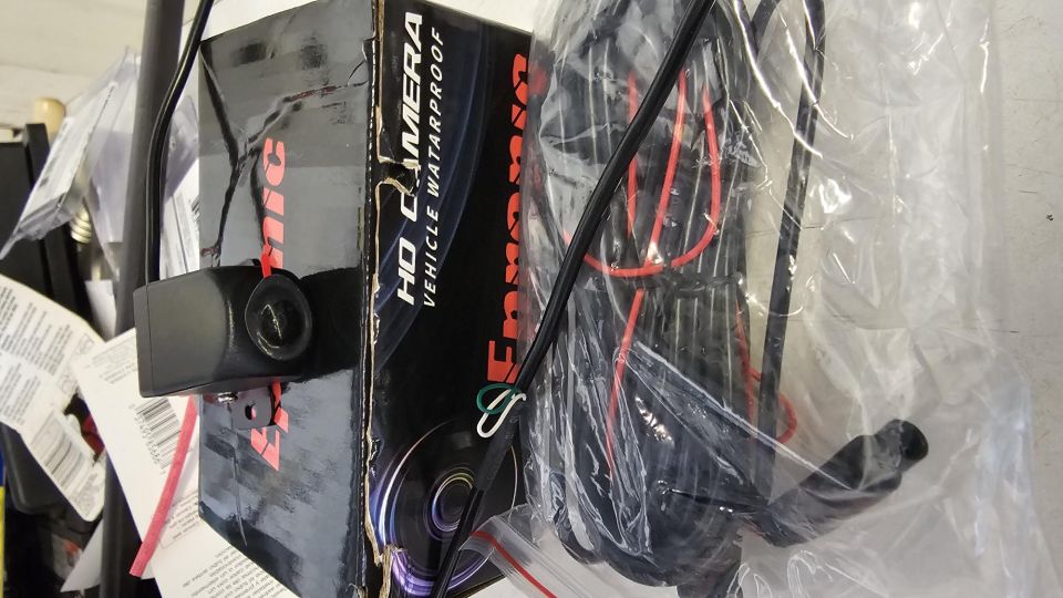 Black HD vehicle waterproof camera mounted on a box.