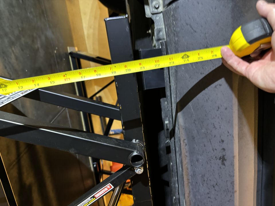 Tape measure extended to 25 inches against a tire sidewall