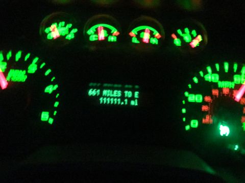 2008 Ford F-250 - The illuminated dashboard displays mileage and fuel range, indicating 111,111.1 miles driven and 661 miles remaining until empty.