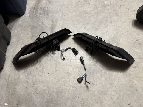 2022 Jeep Wrangler - Pair of aftermarket LED tail lights shown on a concrete surface.