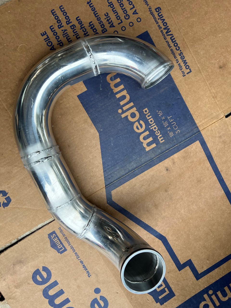 The drivers side pipe from the turbo to the intercooler.