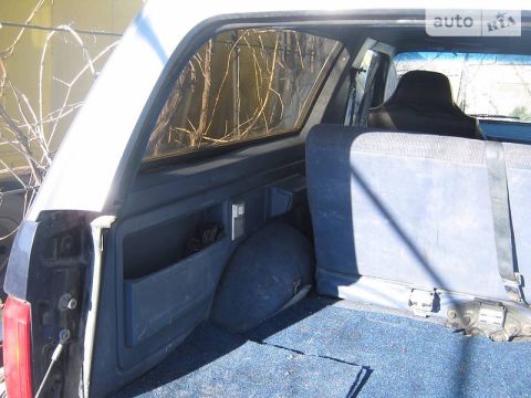 1988 Ford Bronco - Rear interior view of a 1988 Ford Bronco, showing the cargo area and seats.