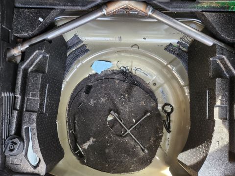 2016 Ford Explorer - Like the rest of the floors, the spare well was littered with cut zip-ties, wires, screws, nuts, & bolts. I'll probably remove the floor-st…