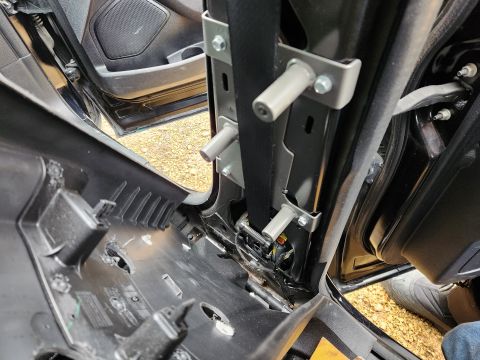 2016 Ford Explorer - The cage was removed, but the anchor plates and the holes in the trim were still there.