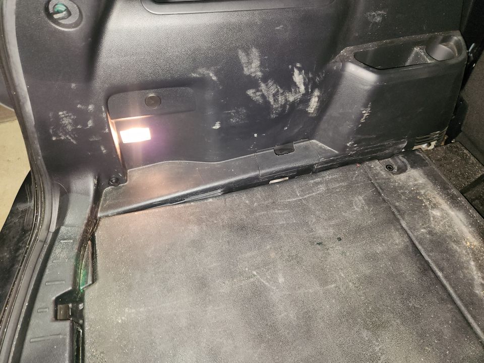 The interior has scuffs & stains.