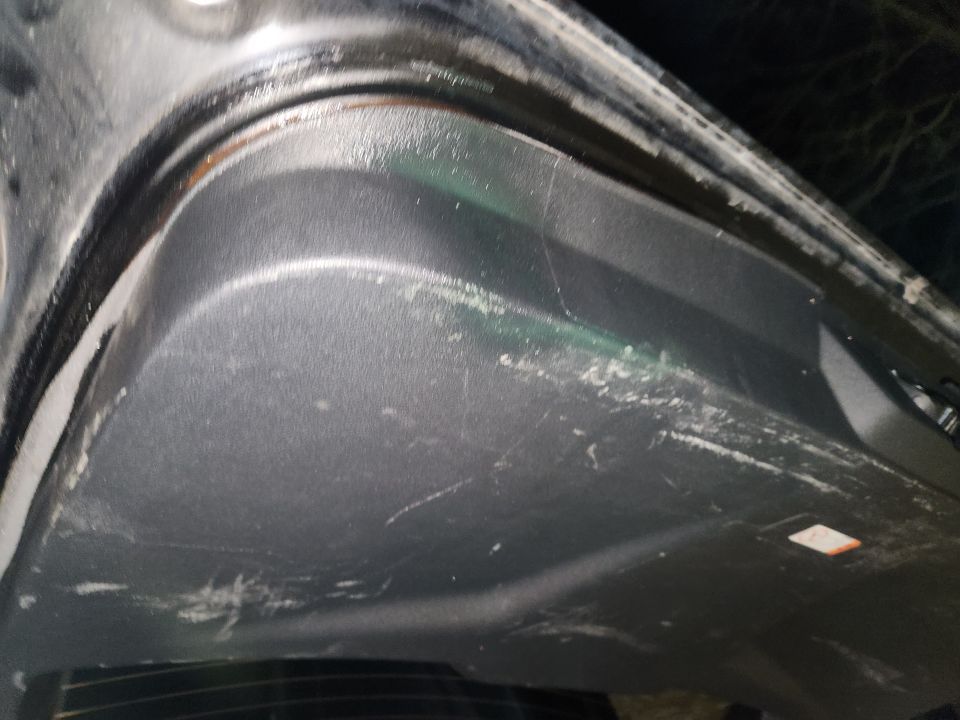 The interior has scuffs & stains.