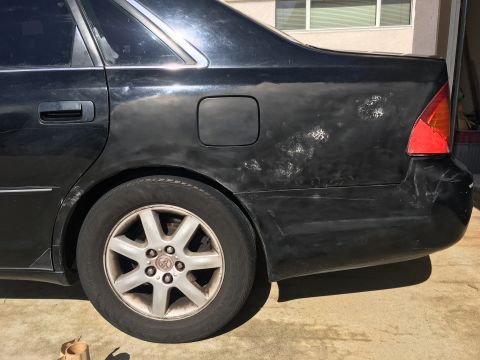 2001 Toyota Avalan - Blackie back quarter after