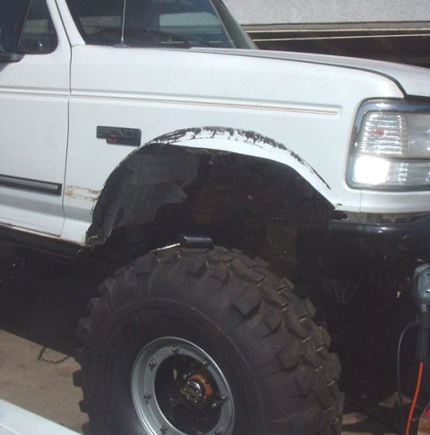 1995 Ford Bronco - front passenger side hacked.