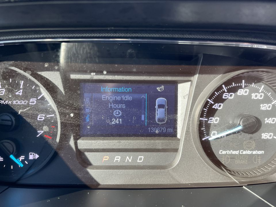 Instrument cluster showing tachometer, speedometer and engine idle hours display