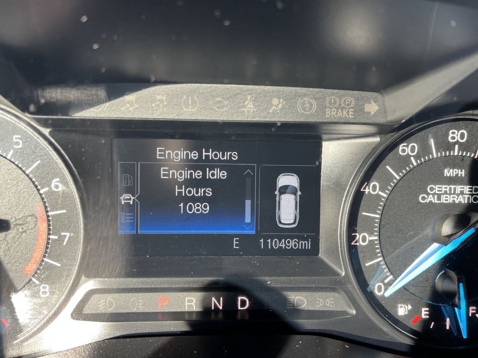 Vehicle instrument cluster showing engine idle hours and 110496 miles