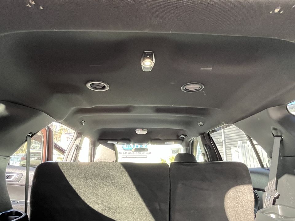 SUV headliner and overhead console viewed from rear seats