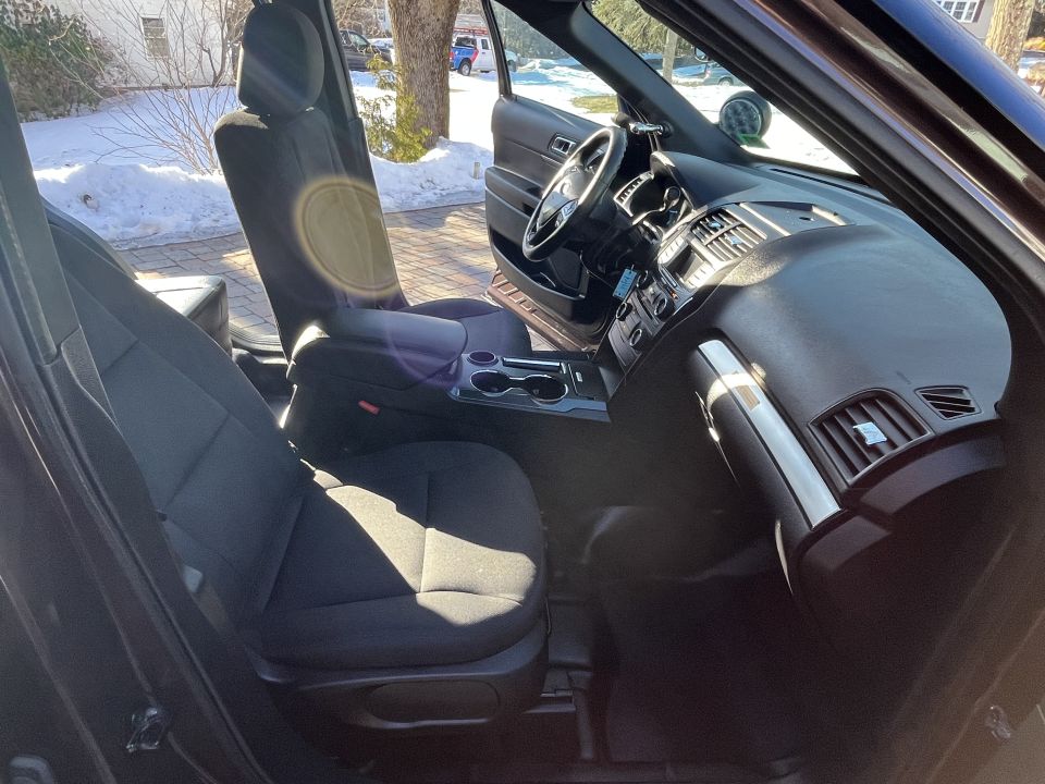 SUV front passenger seat, dashboard, and steering wheel