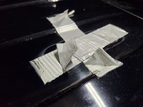 2016 Ford Explorer - This cheap duct tape has been on here long enough for the backing to separate from the adhesive & fibers more easily than from the paint.