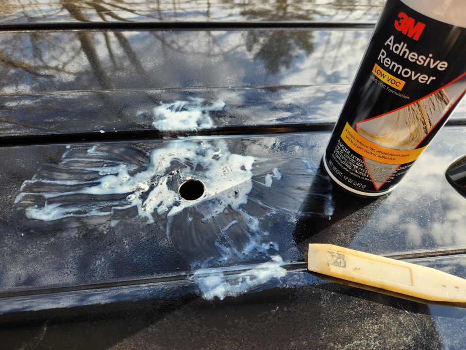 Some 3M Adhesive Remover and a sharpened SpitzNagel (pointy fingernail) plastic scraping tool eventually removed everything with minimal damage to the paint.