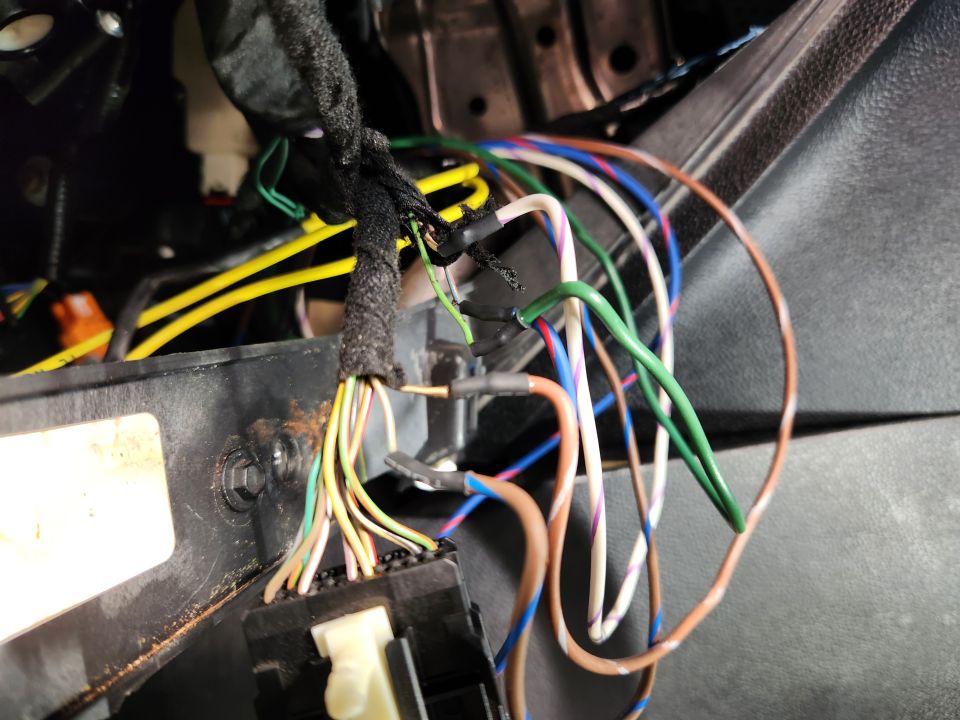 The column-shift wires were cut in the dash harness and extended through to the right side of the console where its connector is.
IF THE IMAGE IS TOO SMALL, click it.