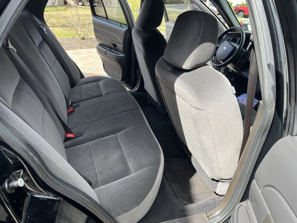 Front and rear cloth seats of a Ford Crown Victoria interior