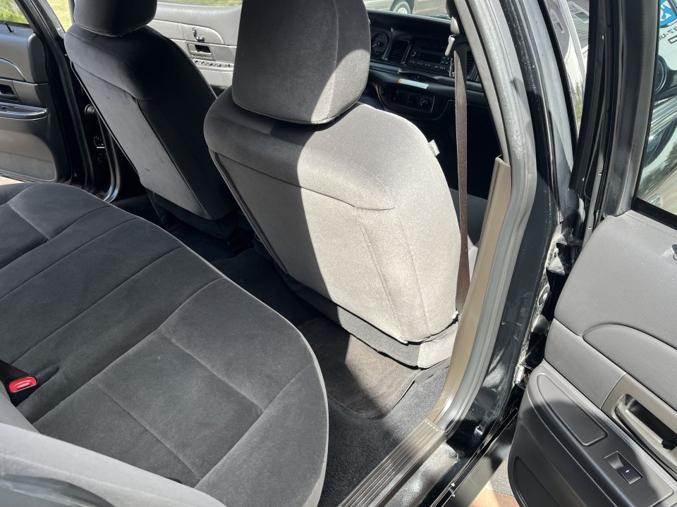 Rear floor, seat backs, and door of a Ford sedan interior