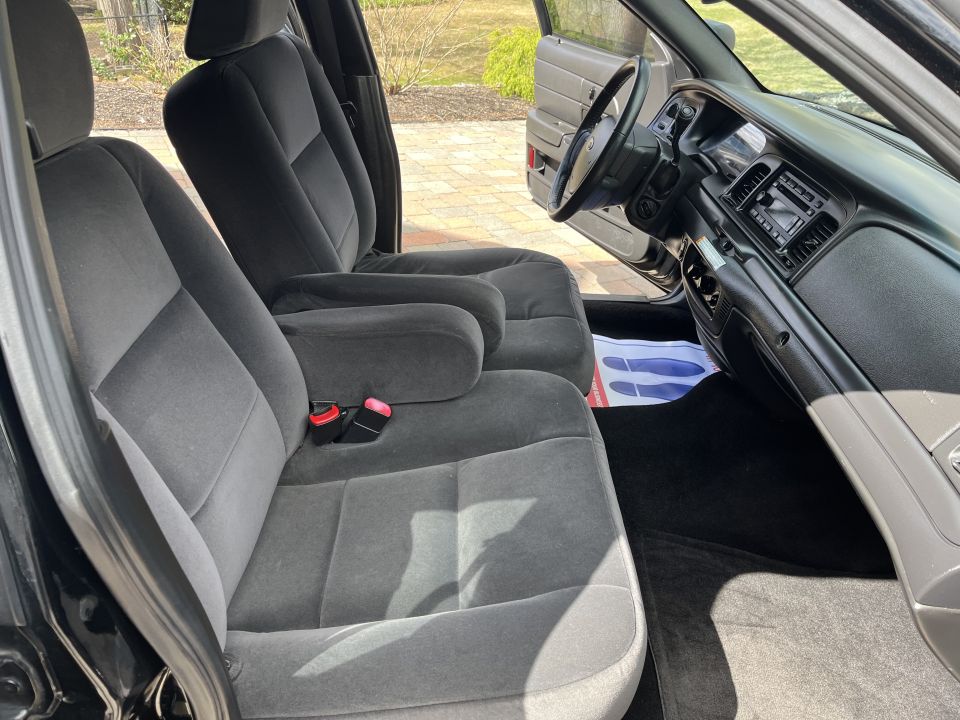Front seats, dash, and center console of a Crown Victoria interior