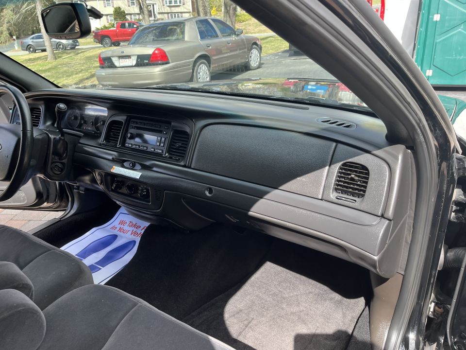 Passenger side dashboard and glovebox area of a Ford Crown Victoria