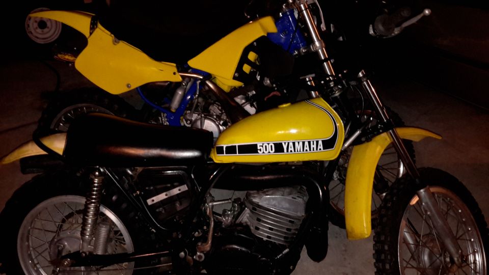 Two yellow Yamaha dirt bikes, one with "500 YAMAHA" on the tank.