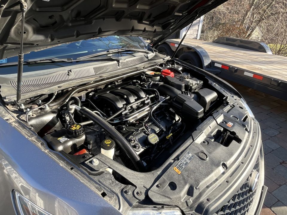 Ford Taurus engine bay with V6 engine, hood open