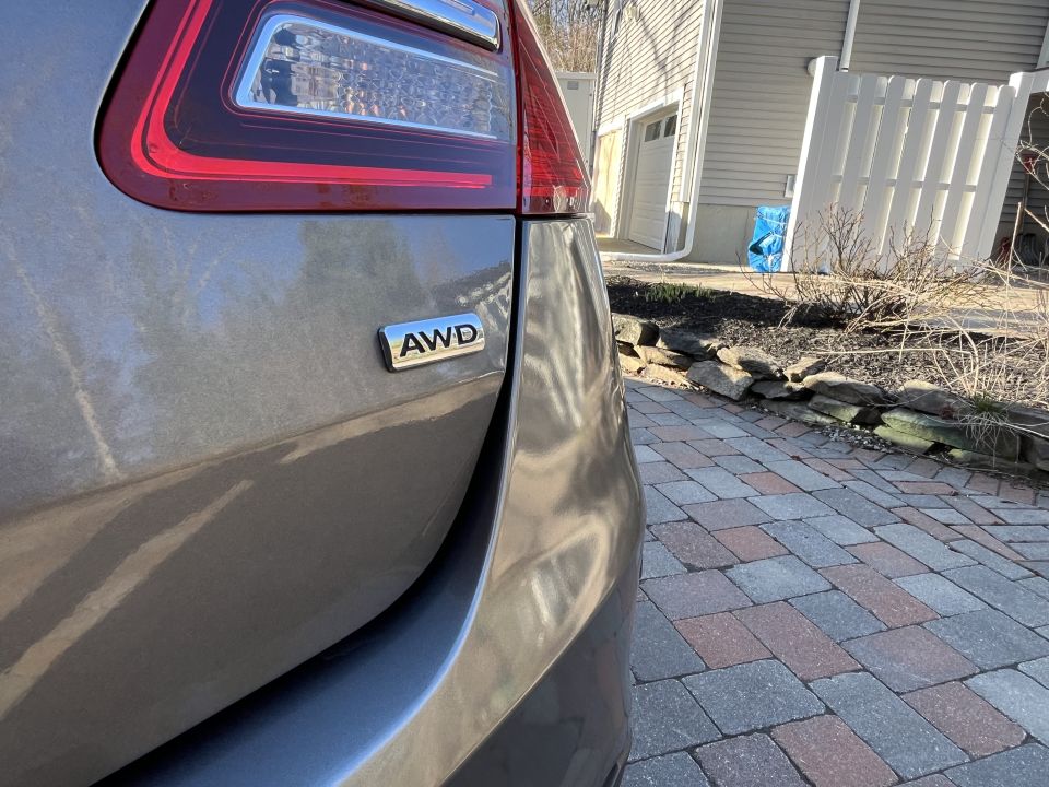 Close-up of Ford Taurus rear quarter with AWD badge