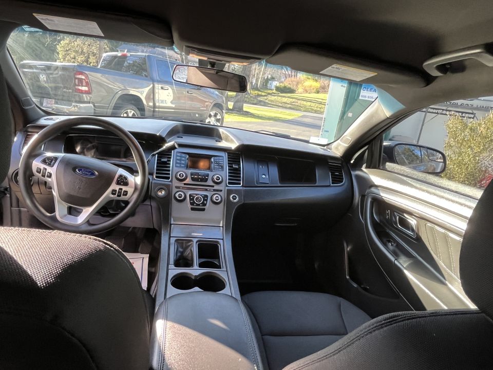 Ford sedan dashboard and center stack viewed from passenger side