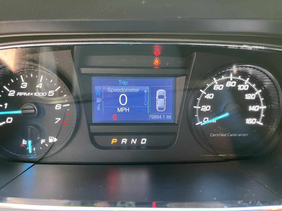 Dashboard gauges showing 0 MPH, 79864.1 miles, and P R N D indicators