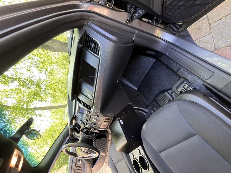 Interior of a 2001 Ford Crown Victoria showing the dashboard, steering wheel, center console with cup holders, and passenger seat