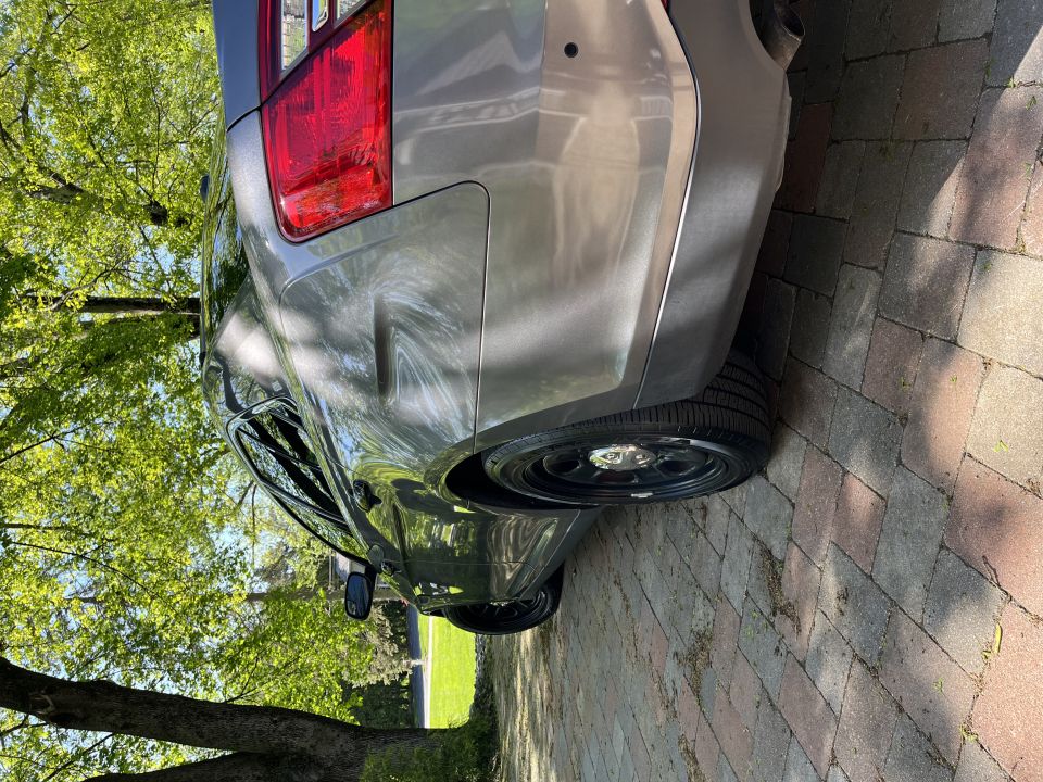 Silver sedan rear quarter panel and taillight
