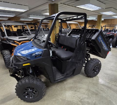 2025 Polaris RANGER - A blue Polaris Ranger 570 EFI utility vehicle is parked indoors with other vehicles.