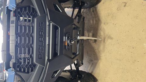 2025 Polaris RANGER - Close-up of a Polaris UTV's front grille and winch assembly.