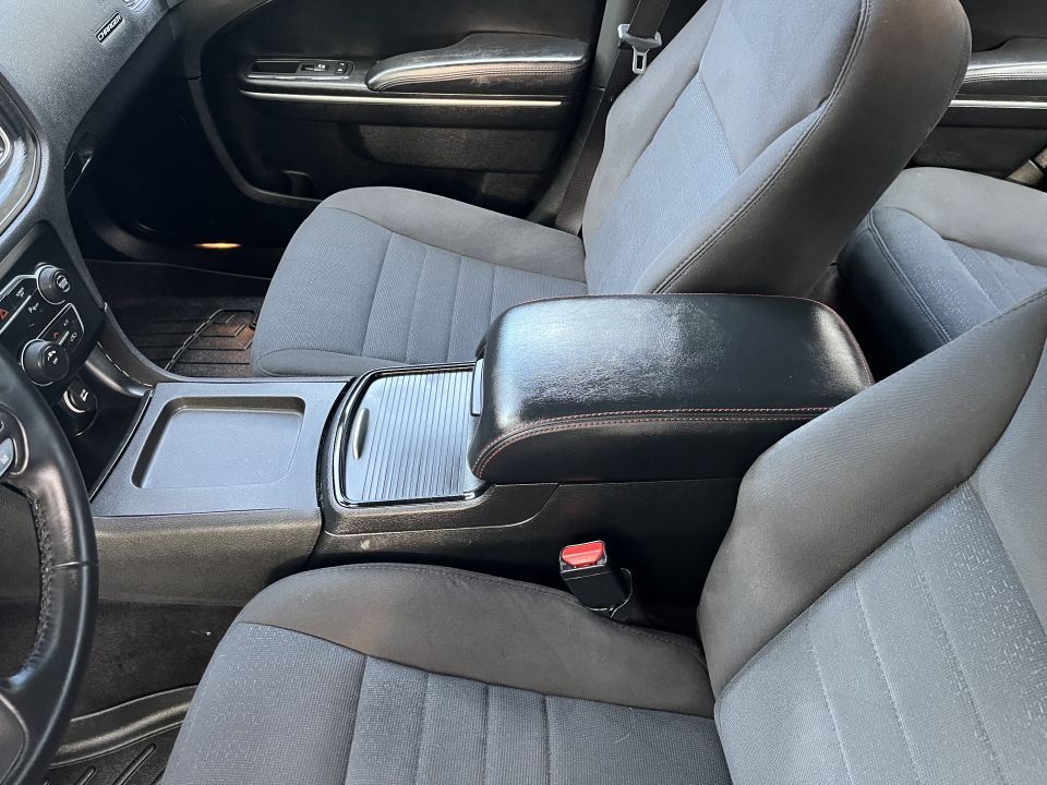 Front cloth seats and center console armrest of a sedan