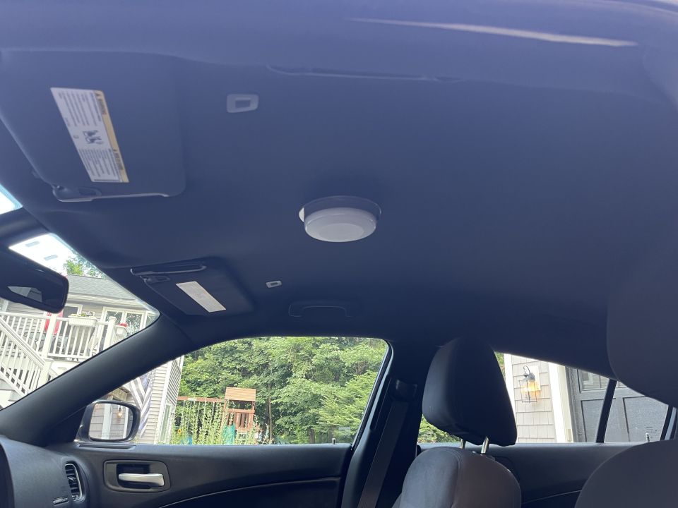 Headliner and roof interior of a sedan with sun visors