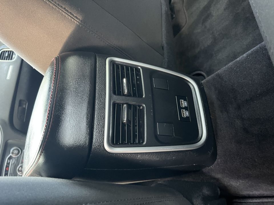 Rear center console vents and USB ports of a Dodge Charger