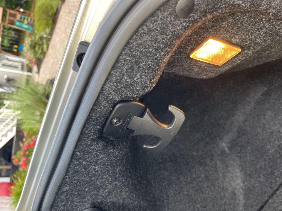 Cargo hook and reflector inside the trunk of a Dodge Charger