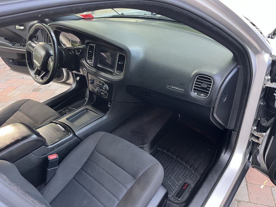 Dashboard and front seats of a Dodge Charger from the passenger door