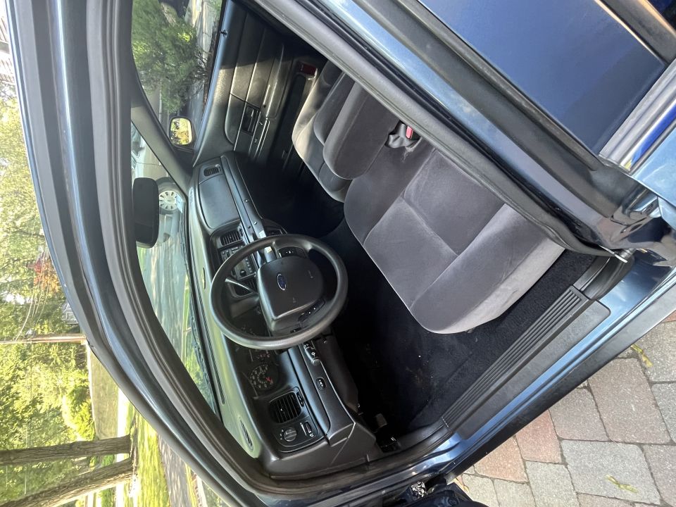 Ford sedan front interior with dash and cloth seats