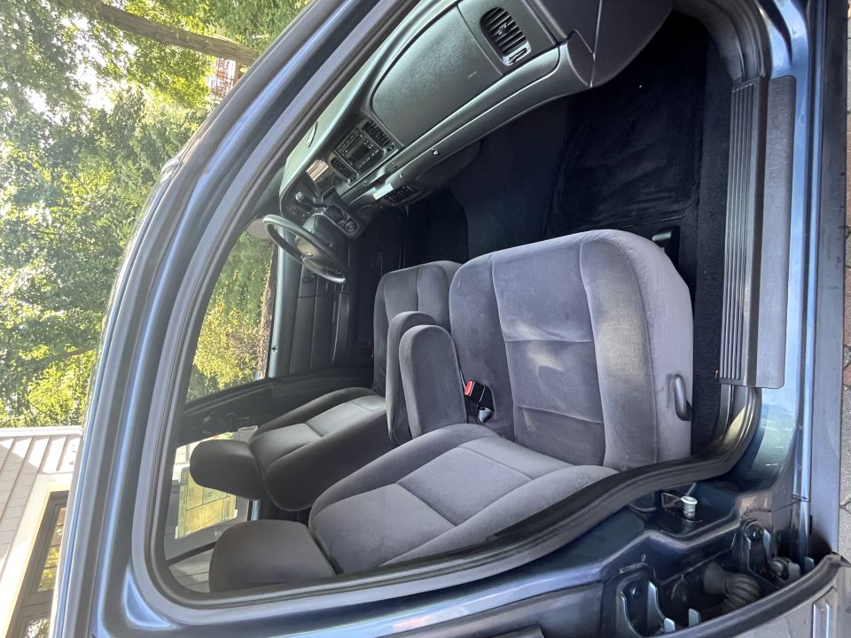 Ford sedan front seats and dashboard interior view