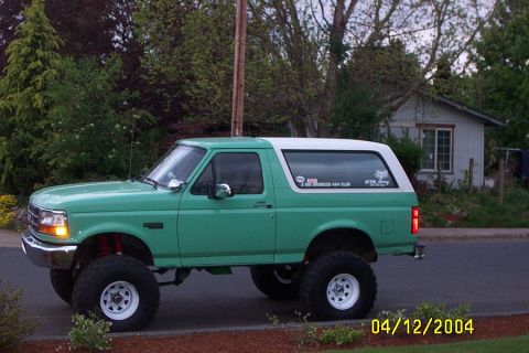 1996 Ford Bronco - This lifted 1996 Ford Bronco features a two-tone green and white paint scheme and off-road tires.