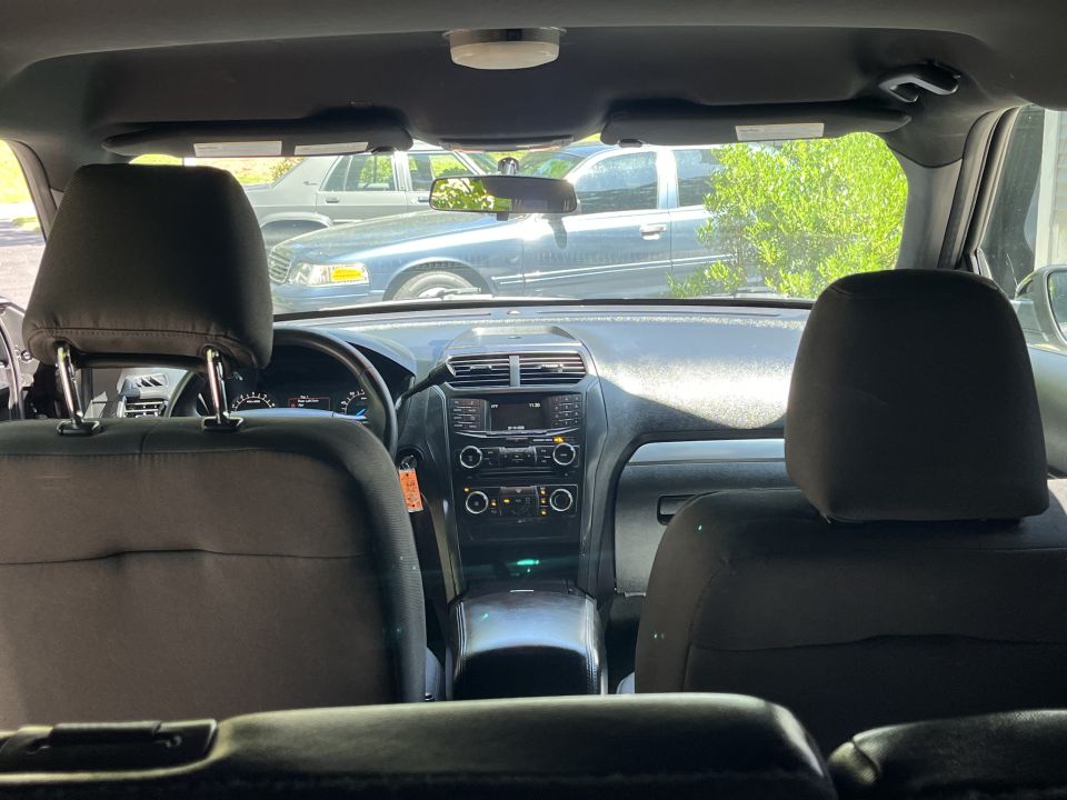 Interior view of a 2001 Ford Crown Victoria, showing dashboard and front seats