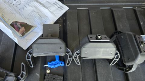 2024 Subaru Impreza - Installation instructions and parts for a roof rack or similar accessory are laid out on a textured surface.
